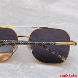 Close-up detail view of Louis Vuitton unisex sunglasses