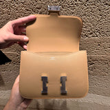 Side view of refined structured handbag
