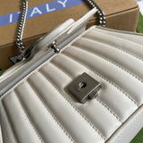 Close-up detail of classic statement women's handbag – women's everyday handbag