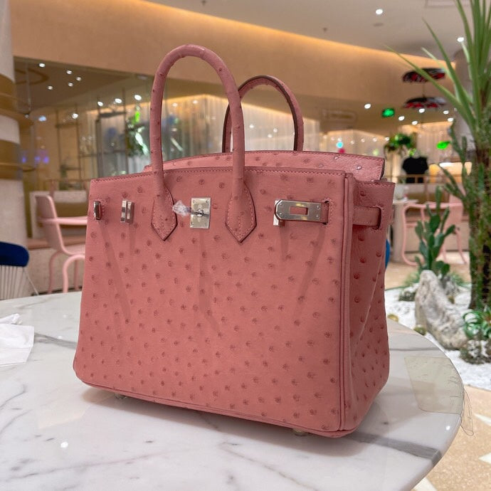 Side view of fluid structured handbag