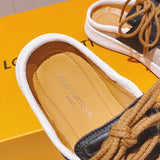 Louis Vuitton Black Pointed-Toe Flats - Heel Detail View