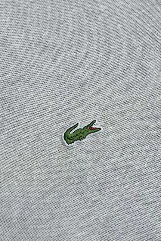 Close-up detail shot of Lacoste luxury clothing with logo-detail design