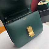 Handle and strap detail of polished elevated women's handbag – women's statement bag