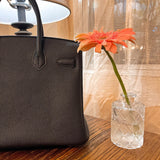 Close-up detail of sculpted bag design
