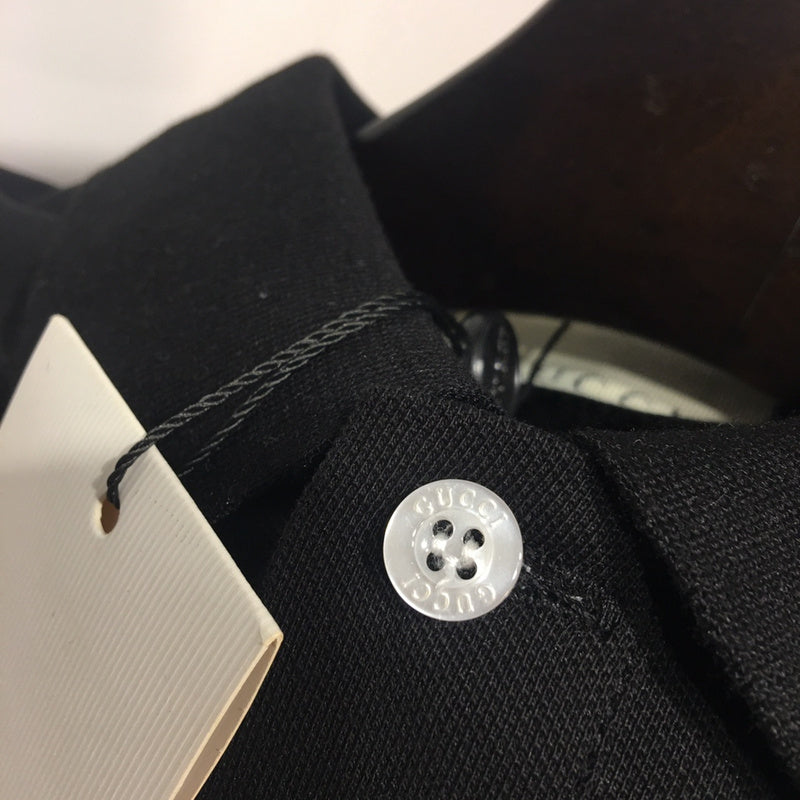 Back view of Gucci luxury clothing with monogram-inspired silhouette