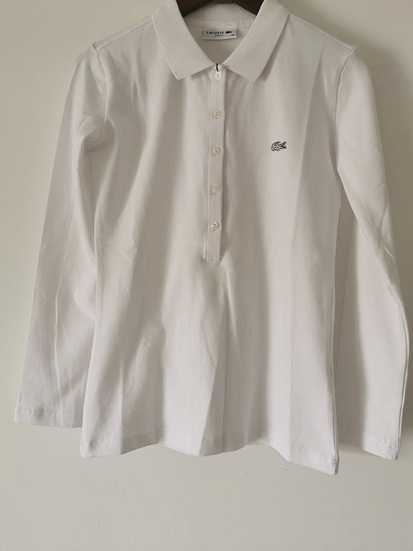 Full styled look of Lacoste luxury clothing with logo-detail design