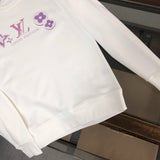 Front view of Louis Vuitton luxury clothing with tailored silhouette