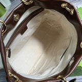 Side profile of elevated structured women's handbag – women's designer-style accessory