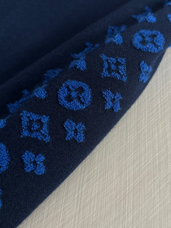Flat lay presentation of Louis Vuitton luxury clothing with contemporary cut