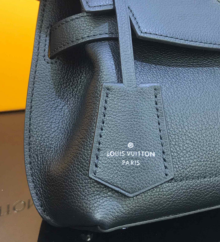 Handle and strap detail of polished signature women's handbag – women's designer-style accessory