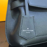 Handle and strap detail of polished signature women's handbag – women's designer-style accessory