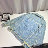 Front view of Louis Vuitton luxury clothing with signature branding