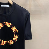 Flat lay presentation of Givenchy luxury clothing with everyday silhouette