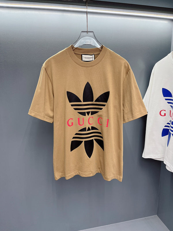Flat lay presentation of Gucci luxury clothing with monogram-inspired silhouette