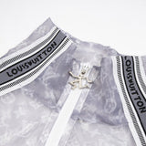 Flat lay presentation of Louis Vuitton luxury clothing with monogram-inspired silhouette