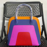 Side view of statement structured handbag