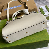Styled lifestyle shot of sleek refined women's handbag – women's designer-style accessory