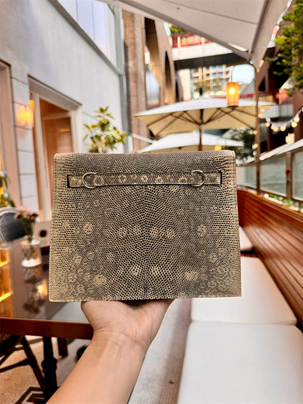 Side view of streamlined structured handbag