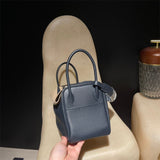 Side view of tailored structured handbag