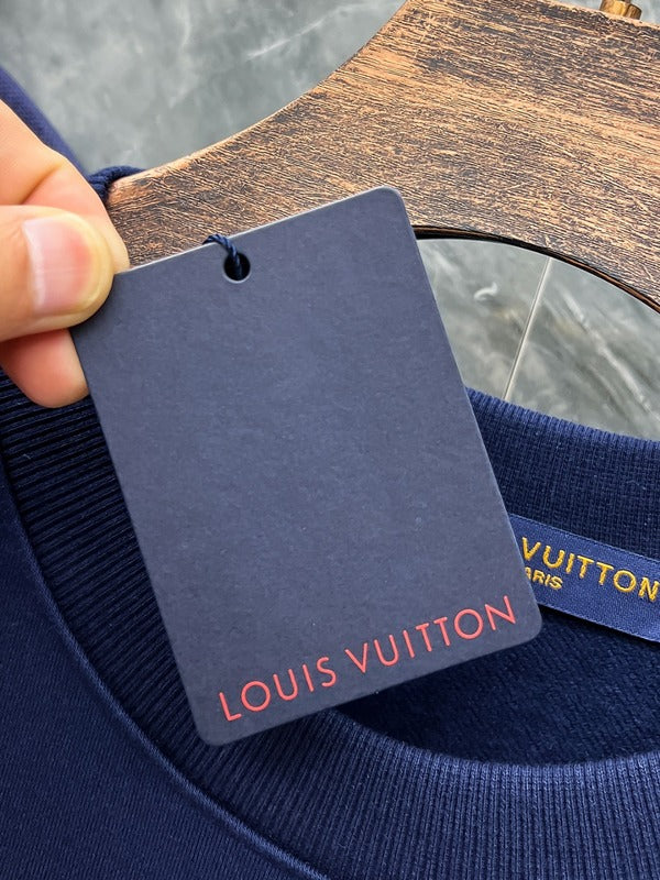 Close-up detail shot of Louis Vuitton luxury clothing with tailored silhouette