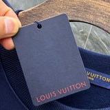 Close-up detail shot of Louis Vuitton luxury clothing with tailored silhouette