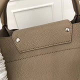 Handle and strap detail of modern premium women's handbag – women's statement bag