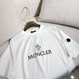 Side profile of Moncler luxury clothing with monogram-inspired silhouette