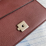 Close-up detail of signature chic women's handbag – women's luxury accessory