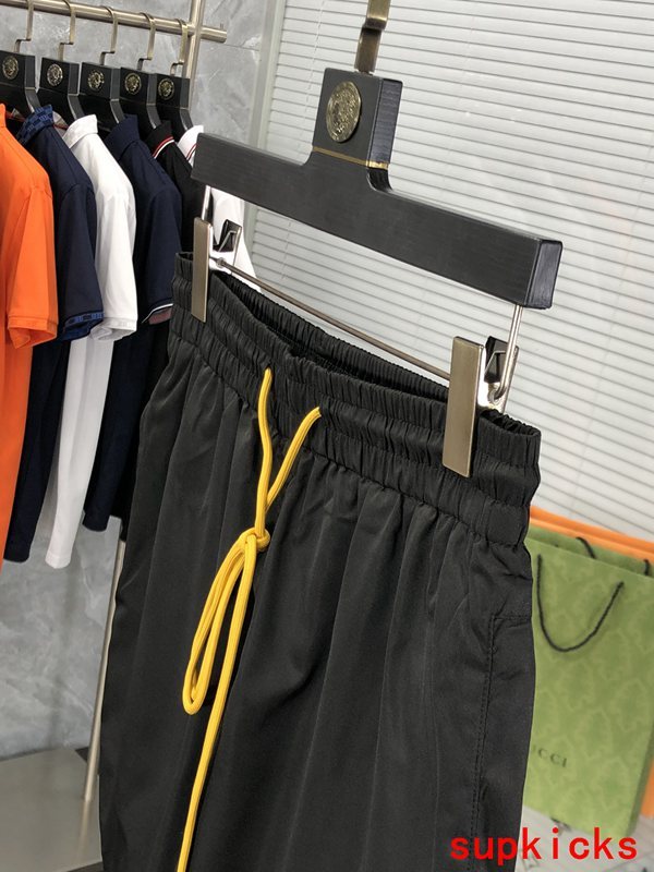 Flat lay presentation of Rhude luxury clothing with label-forward styling