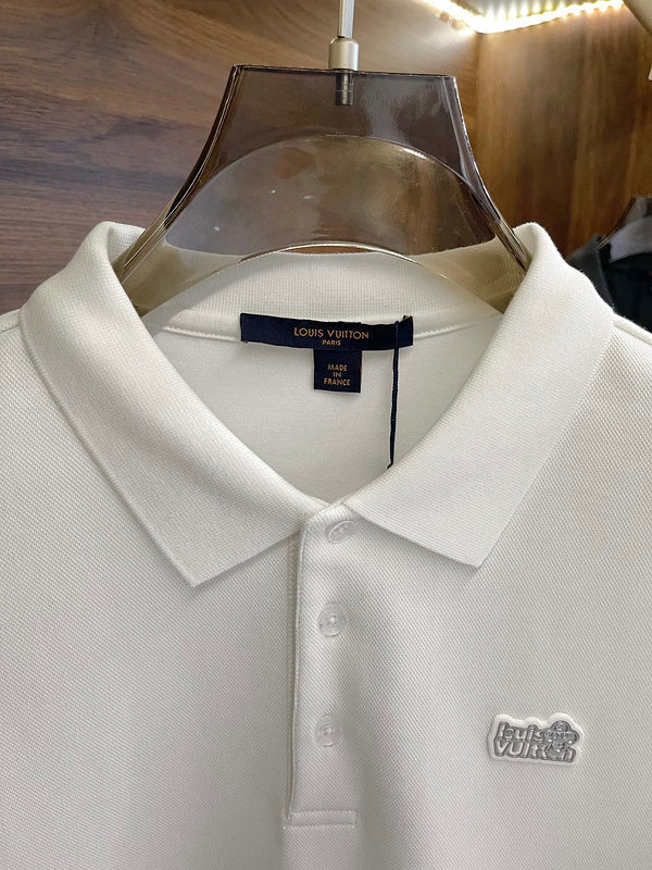 Close-up detail shot of Louis Vuitton luxury clothing with label-forward styling