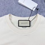 Close-up detail shot of Gucci luxury clothing with signature branding
