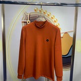 Front view of Louis Vuitton luxury clothing with monogram-inspired silhouette