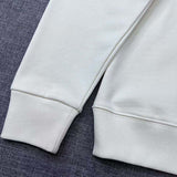 Side profile of Gucci luxury clothing with signature branding