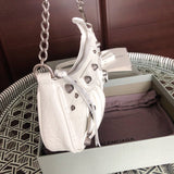 Handle and strap detail of elevated chic women's handbag – women's luxury accessory