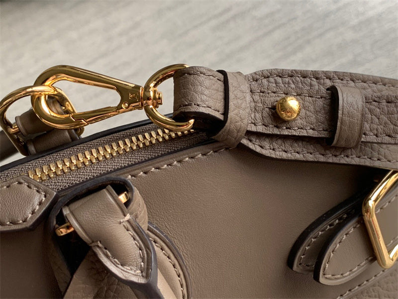  Polished top-handle bag carried on shoulder 16