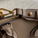  Polished top-handle bag carried on shoulder 16