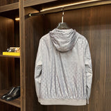 Close-up detail shot of Louis Vuitton luxury clothing with label-forward styling