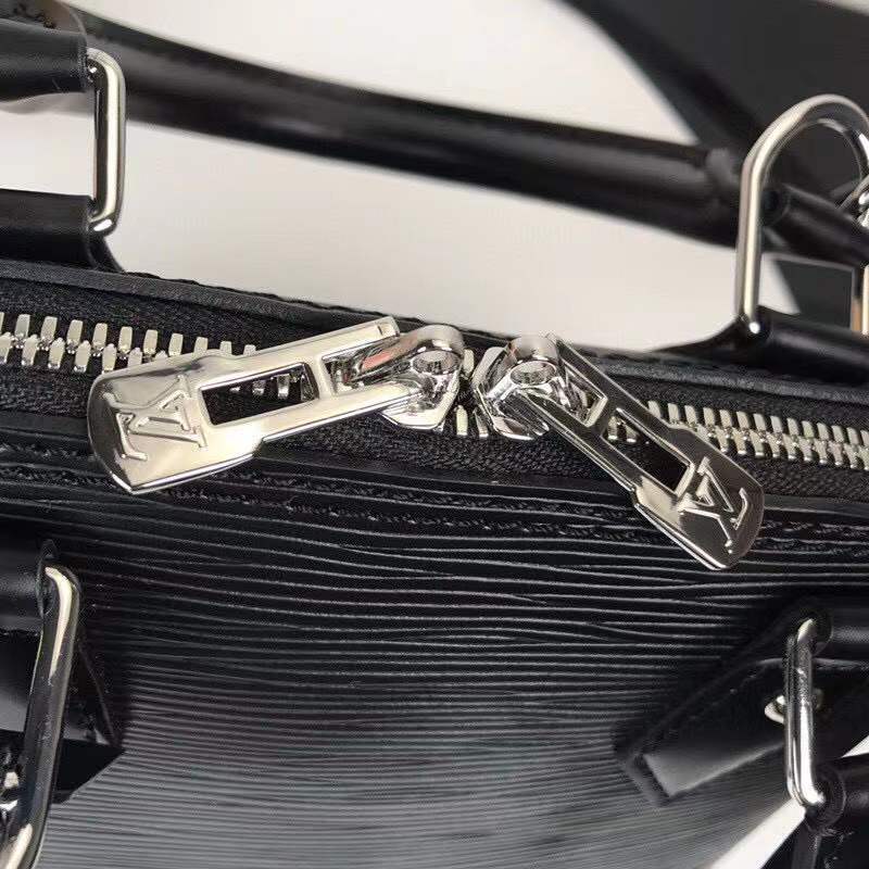 Styled lifestyle shot of classic signature women's handbag – women's luxury handbag