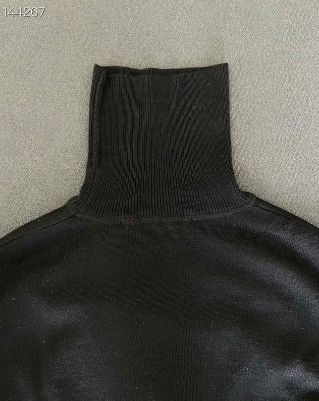Close-up detail shot of Louis Vuitton luxury clothing with everyday silhouette