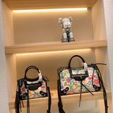 Ziva's Charm handbag – close-up view (one versatile size)