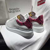 Alexander McQueen fresh white-and-black luxury sneakers view 8 signature lace-up style