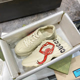 Gucci crisp white luxury sneakers view 7 retro runner design