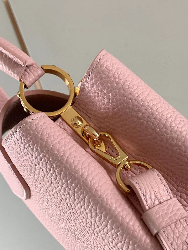 Handle and strap detail of modern statement women's handbag – women's luxury handbag