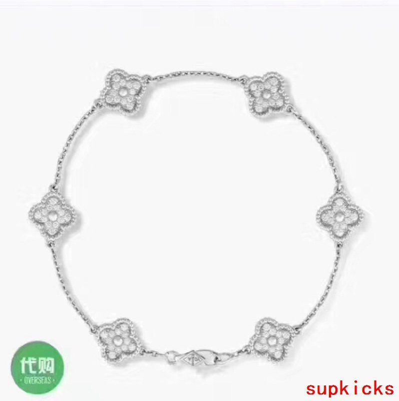 Lifestyle view of Van Cleef & Arpels unisex jewelry piece