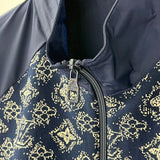 Close-up detail shot of Louis Vuitton luxury clothing with label-forward styling