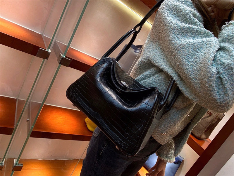  Sleek structured bag carried on shoulder 10