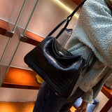  Sleek structured bag carried on shoulder 10