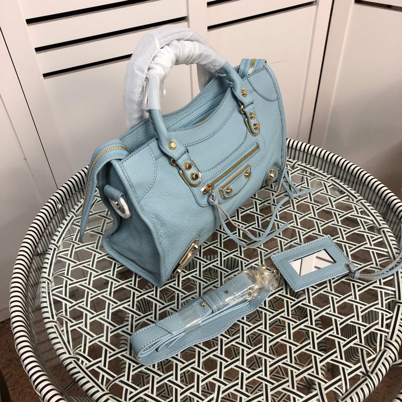 Handle and strap detail of chic everyday-luxe women's handbag – women's statement bag