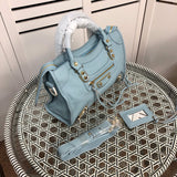 Handle and strap detail of chic everyday-luxe women's handbag – women's statement bag