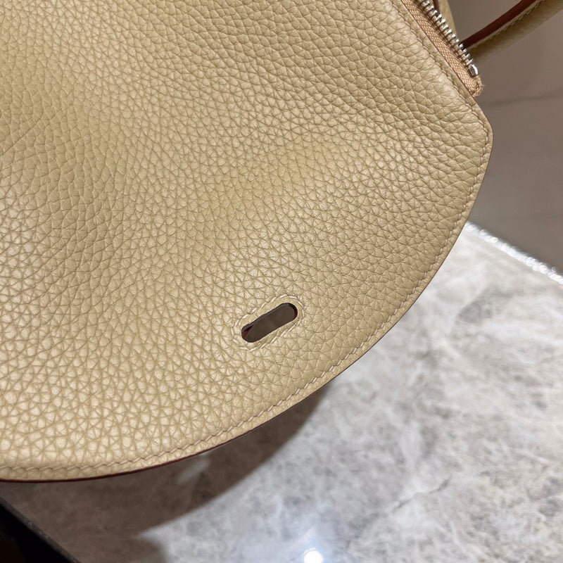 Side view of polished structured handbag